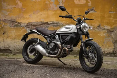 Bold Ducati Wallpaper Cars Wallpaper 4K 4096x2726 A, Ducati, Scrambler, Motorcycle, Parked, In, Front, Of, Weathered, Yellow, Wall, Captured, Orange, Brown, Ultrawide, 4k