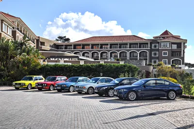 Moody Lineup Wallpaper Cars Wallpaper 4K 4096x2731 A, Lineup, Of, Colorful, Bmw, Cars, Including, Standout, Yellow, Vehicle, Parked, Front, White, Gray, Landscape, 4k