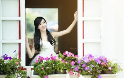 Asian Woman Smiling Nature Wallpaper 4K 1920x1200 Asian, Woman, Smiling, And, Standing, At, An, Open, Window, Framed, Vibrant, Flowers, White, Ultrawide, Full HD