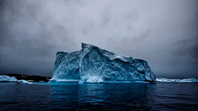 Vibrant Iceberg Wallpaper Nature Wallpaper 4K 3840x2160 A, Striking, Iceberg, Looms, Majestically, Over, Dark, Waters, Beneath, Moody, Sky, Capturing, Gray, Ultrawide, 4k