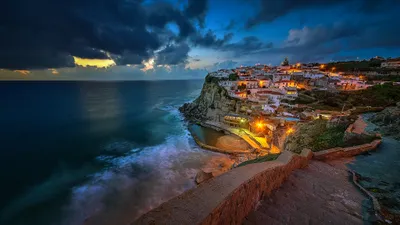 Dark Nighttime Wallpaper World Wallpaper 4K 2048x1152 A, Stunning, Nighttime, View, Of, Cliffside, Town, Portugal, Overlooking, Tranquil, Ocean, Illuminated, Red, Brown, Ultrawide, Full HD