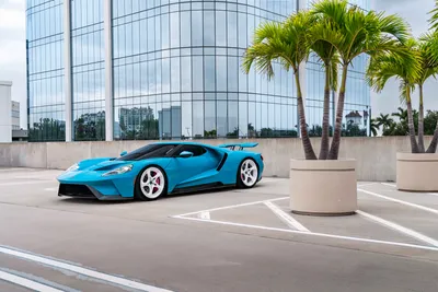 Blue Rooftop Beside Abstract Wallpaper 4K 9504x6336 Blue, Ford, Gt, Parked, On, A, Rooftop, Beside, Potted, Palms, Reflective, Glass, Gray, White, Landscape, 4k