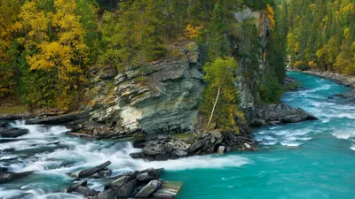 Moody Vibrant Wallpaper Nature Wallpaper 4K 3840x2160 A, Vibrant, Nature, Scene, Featuring, Turquoise, River, Flowing, Around, Rocky, Cliffs, Lush, Brown, Purple, Ultrawide, 4k