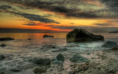 Serene Sunset Ocean Nature Wallpaper 4K 2560x1600 A, Serene, Sunset, Over, The, Ocean, Framed, By, Rocky, Shores, Capturing, Beauty, Gray, Orange, Ultrawide, QHD