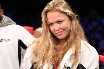 Sleek Ronda Wallpaper Abstract Wallpaper 4K 1920x1280 Ronda, Rousey, Confidently, Smiles, In, A, Sports, Setting, Showcasing, Her, Dynamic, Presence, White, Landscape, Full HD