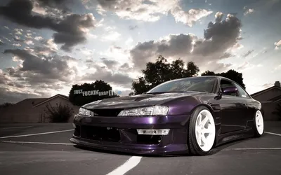 Sleek Purple Car White Wheels Nature Wallpaper 4K 1920x1200 A, Sleek, Purple, Car, With, White, Wheels, Is, Showcased, Against, Cloudy, Sky, Ultrawide, Full HD