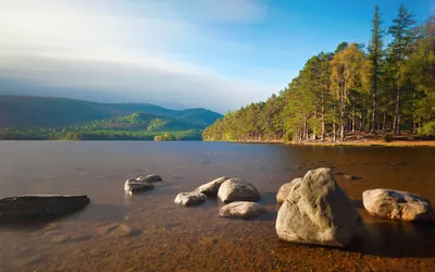 Calm Tranquil Wallpaper Nature Wallpaper 4K 2560x1600 Tranquil, Lakeshore, With, Rocks, In, The, Foreground, And, Forested, Hills, Under, Blue, White, Ultrawide, QHD