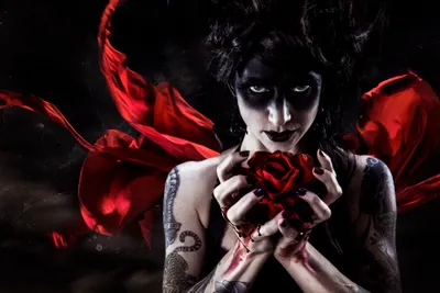 Woman Dark Makeup Black/Dark Wallpaper 4K 3865x2576 A, Woman, With, Dark, Makeup, And, Tattoos, Holds, Red, Rose, Surrounded, Flowing, Gray, Ultrawide, 4k