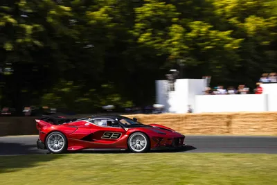 Red Race Car Streaks Along Cars Wallpaper 4K 5622x3748 Red, Ferrari, Race, Car, (#93), Streaks, Along, A, Sunlit, Track, Blurred, Trees, White, Gray, Brown, Landscape, 4k