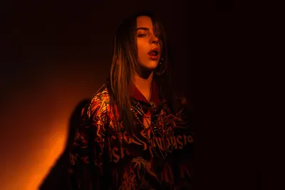 Sleek American Wallpaper Abstract Wallpaper 4K 6840x4560 American, Singer, Billie, Eilish, Illuminated, By, Warm, Dramatic, Lighting, Vibrant, Ultra, Desktop, Brown, Orange, Red, Landscape, 4k