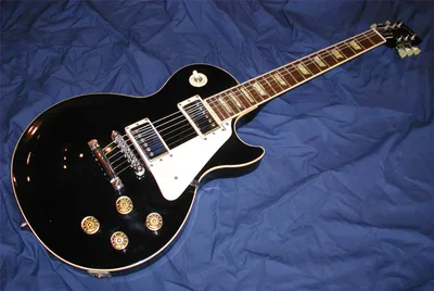 Black Electric Guitar Black/Dark Wallpaper 4K 1881x1261 An, Hd, Desktop, Wallpaper, Featuring, A, Black, Electric, Guitar, White, Pickguard, Resting, Brown, Landscape