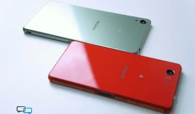 Two Glossy Phones Technology Wallpaper 4K 2000x1177 Two, Glossy, Phones, Red, And, Silver, Lying, Back-to-back, White, Surface, Technology, Phone, Ultrawide, Full HD