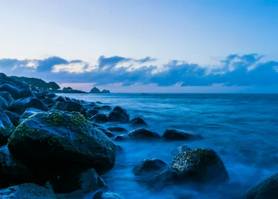 Serene Coastline Rocky Shorelines Meeting Nature Wallpaper 4K 4201x3000 A, Serene, Coastline, With, Rocky, Shorelines, Meeting, The, Ocean, Under, Vast, Horizon, White, Landscape, 4k
