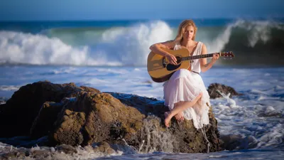 Bold Woman Wallpaper Nature Wallpaper 4K 3840x2160 A, Woman, In, White, Dress, Playing, Guitar, While, Sitting, Seaside, Rocks, Waves, Gray, Pink, Ultrawide, 4k