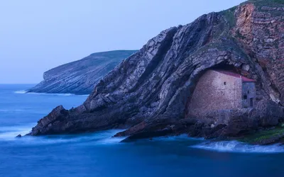 Man Stone House Built Rocky Nature Wallpaper 4K 1920x1200 A, Man-made, Stone, House, Built, Into, Rocky, Cliff, Ocean, Captured, Serene, Desktop, White, Pink, Ultrawide, Full HD