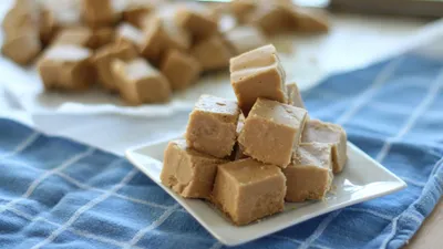 Calm Close Wallpaper Abstract Wallpaper 4K 5000x2813 Close-up, Of, Creamy, Peanut, Butter, Fudge, Cubes, Stacked, White, Plate, Captured, Sharp, Brown, Gray, Ultrawide, 4k