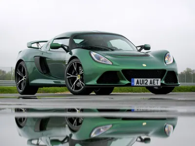 Sleek Green Lotus Cars Wallpaper 4K 2048x1536 A, Sleek, Green, Lotus, Exige, Sports, Car, With, Black, Accents, Showcased, Wet, White, Landscape, Full HD