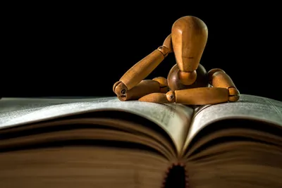 Vivid Man Wallpaper Abstract Wallpaper 4K 3840x2563 A, Man-made, Wooden, Mannequin, Resting, Its, Head, On, Open, Book, Captured, Sharp, Gray, White, Orange, Landscape, 4k