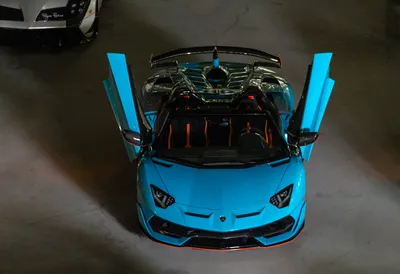 Bright Down Wallpaper Cars Wallpaper 4K 5120x3509 Top-down, View, Of, A, Sky-blue, Lamborghini, Car, With, Scissor, Doors, Open, Captured, Green, Red, Landscape, 4k