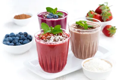 Three Vibrant Berry Minimal Wallpaper 4K 2048x1367 Three, Vibrant, Berry, And, Chocolate, Smoothies, Garnished, With, Fresh, Blueberries, Strawberries, Mint, White, Landscape, Full HD
