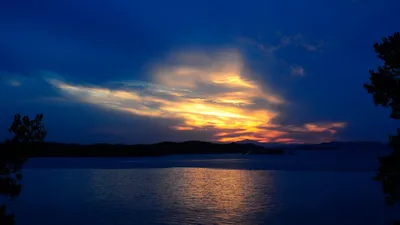 Radiant Tranquil Wallpaper Nature Wallpaper 4K 1920x1080 A, Tranquil, Sunset, Over, Water, Featuring, Deep, Blues, Warm, Orange, Hues, Creating, Brown, Gray, Ultrawide, Full HD