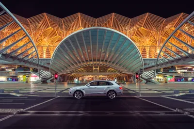 Silver Bentley Bentayga Suv Black/Dark Wallpaper 4K 4096x2731 Silver, Bentley, Bentayga, Suv, Centered, In, Front, Of, Illuminated, Contemporary, Architectural, Terminal, Orange, Gray, Brown, Landscape, 4k
