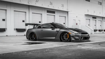 Silver Sports Car Widebody Cars Wallpaper 4K 3840x2160 Silver, Nissan, Gt-r, Sports, Car, With, Widebody, And, Rear, Wing, Parked, Industrial, Gray, White, Ultrawide, 4k