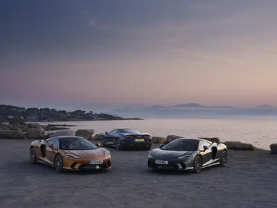 Crisp Three Wallpaper Cars Wallpaper 4K 8000x6000 Three, Mclaren, Gt, Supercars, Orange, Silver, And, Gunmetal, Parked, Coastal, Overlook, Gray, Landscape, 4k