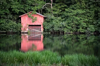 Red Man Boathouse Riverbank Nature Wallpaper 4K 2200x1466 Red, Man-made, Boathouse, On, A, Riverbank, Under, Dense, Trees, Ade, Surrounding, Foliage, Pink, Gray, Ultrawide, Full HD
