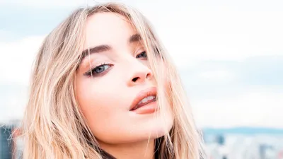 Close Blonde Singer Abstract Wallpaper 4K 3448x1939 Close-up, Of, A, Blonde, Singer, With, Blue, Eyes, Face, Framed, Windblown, Hair, White, Ultrawide, QHD