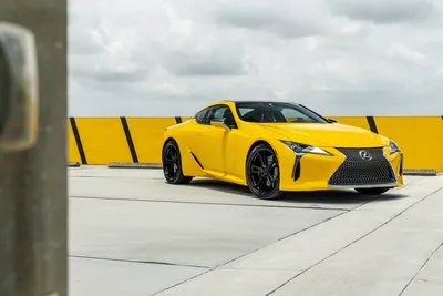 Bold Yellow Wallpaper Nature Wallpaper 4K 7878x5256 Yellow, Lexus, Lc, 500, Supercar, Parked, On, A, Rooftop, Against, Yellow-striped, Barrier, White, Landscape, 4k