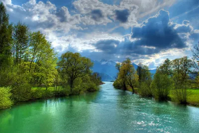 Serene River Flows Lush Greenery Nature Wallpaper 4K 2000x1337 A, Serene, River, Flows, Through, Lush, Greenery, Under, Dramatic, Sky, Illuminated, Sunbeams, Gray, Landscape, Full HD