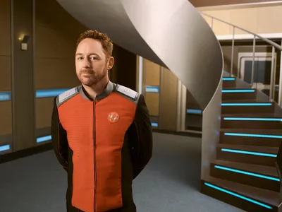 Character Orville Standing Space Wallpaper 4K 1950x1462 Hd, Desktop, Wallpaper, Of, A, Character, From, The, Orville, Standing, Corridor, Spaceship, Orange, Red, White, Landscape, Full HD