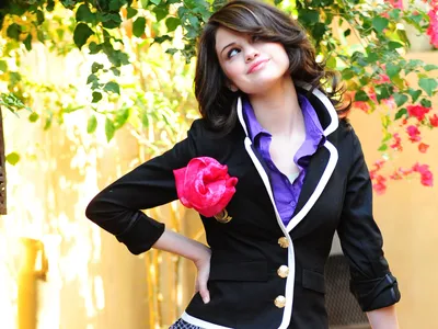Vivid Selena Wallpaper Black/Dark Wallpaper 4K 1920x1440 Selena, Gomez, Poses, Playfully, With, A, Pink, Flower, Stylish, Black, Blazer, Set, White, Landscape, Full HD
