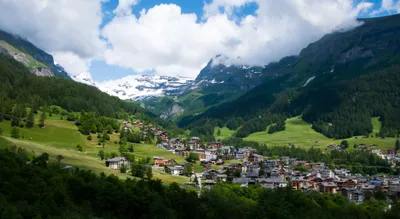 Swiss Village Nestled Mountains Nature Wallpaper 4K 3907x2141 A, Stunning, View, Of, Swiss, Village, Nestled, Mountains, Showcasing, Lush, Greenery, Snow-capped, White, Ultrawide, 4k