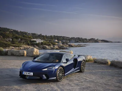 Blue Mclaren Supercar Cars Wallpaper 4K 8256x6192 Blue, Mclaren, Gt, Supercar, Parked, On, A, Rocky, Seaside, Quay, Sunset, Sleek, Gray, Landscape, 4k