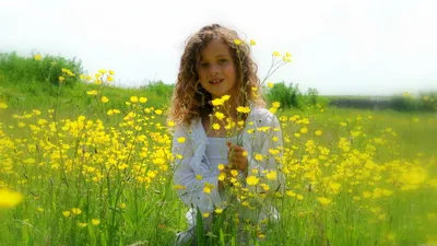Radiant Joyful Wallpaper Nature Wallpaper 4K 2560x1440 A, Joyful, Child, With, Curly, Hair, Sits, Among, Vibrant, Yellow, Flowers, Capturing, White, Ultrawide, QHD