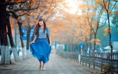 Woman Walks Along Nature Wallpaper 4K 2560x1600 A, Woman, Walks, Along, Tree-lined, Path, With, Colorful, Autumn, Foliage, Wearing, Blue, White, Gray, Ultrawide, QHD