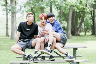 Three Members Bts Pose Playfully Abstract Wallpaper 4K 2000x1333 Three, Members, Of, Bts, Pose, Playfully, On, A, Picnic, Table, Surrounded, Greenery, White, Ultrawide, Full HD