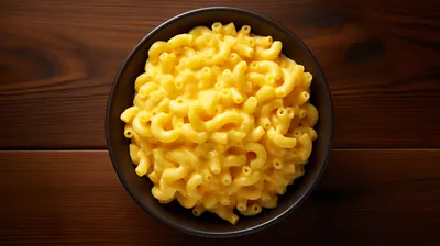 Close Creamy Mac Cheese Dark Black/Dark Wallpaper 4K 2912x1632 A, Close-up, View, Of, Creamy, Mac, And, Cheese, Dark, Bowl, Set, Against, Yellow, Orange, Ultrawide, QHD
