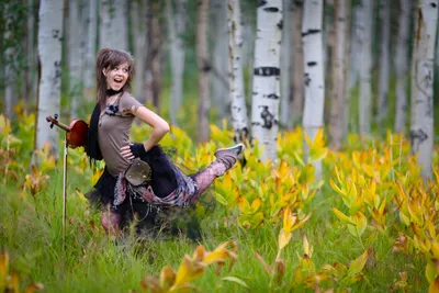 Sleek Lindsey Wallpaper Nature Wallpaper 4K 5760x3840 Lindsey, Stirling, Joyfully, Poses, With, A, Violin, In, Vibrant, Natural, Setting, Filled, Gray, Landscape, 4K