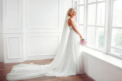 Dark Blonde Wallpaper Abstract Wallpaper 4K 4032x2688 Blonde, Bride, In, A, Flowing, White, Wedding, Dress, Holds, Bouquet, Large, Window, Landscape, 4K