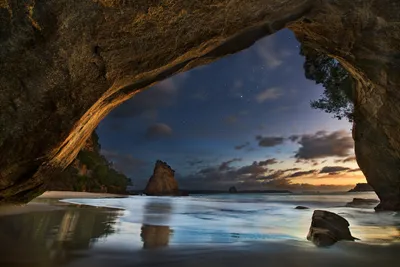 Golden Serene Wallpaper Nature Wallpaper 4K 2500x1668 A, Serene, Night, Scene, Of, Cave, Opening, Showcasing, Coastal, Landscape, Gentle, Waves, Gray, Full HD