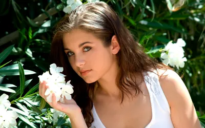 Woman Dark Hair Black/Dark Wallpaper 4K 1920x1200 A, Woman, With, Dark, Hair, Wearing, White, Top, Holding, Flowers, Standing, Front, Gray, Ultrawide, Full HD