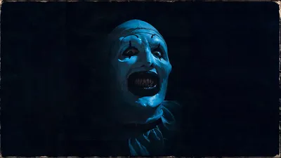 Terrifier Clown Pale Black/Dark Wallpaper 4K 3840x2160 Terrifier, Clown, With, Pale, Face, And, Jagged, Teeth, Lit, Cold, Blue, Mouth, Brown, Red, Ultrawide, 4k
