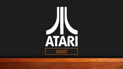 Crisp Minimalist Wallpaper Minimal Wallpaper 4K 3840x2160 Minimalist, Atari, 2600, Logo, In, White, On, A, Black, Wooden, Surface, Below, Teal, Ultrawide, 4k