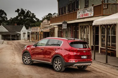 Red Kia Sportage Suv Dusty World Wallpaper 4K 4000x2667 Red, Kia, Sportage, Suv, Parked, On, A, Dusty, Street, Rustic, Town, Featured, Gray, Landscape, 4k
